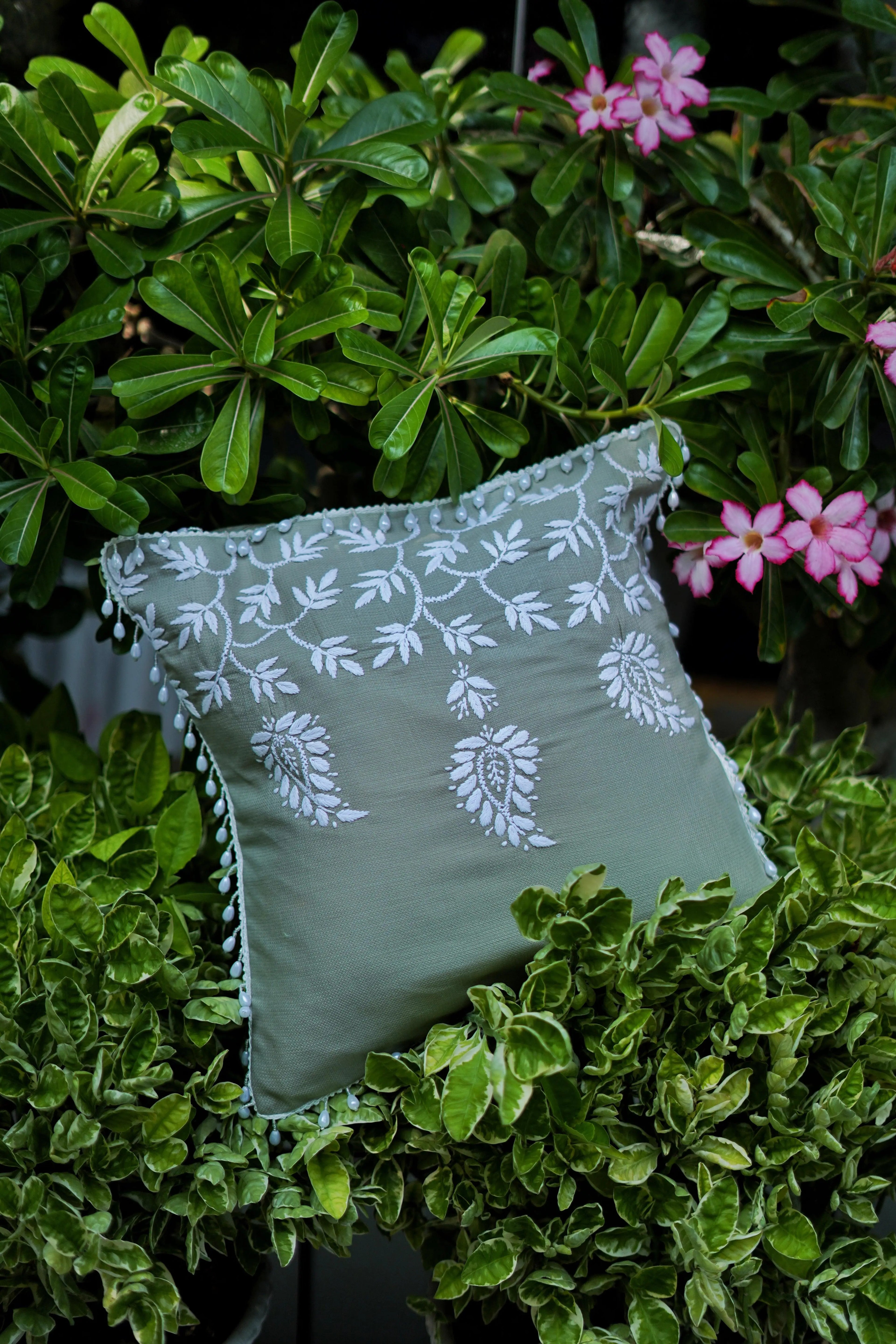Chikankari cushion cover by Sukhara showcasing intricate handmade embroidery inspired by mango trees, perfect for luxury home decor