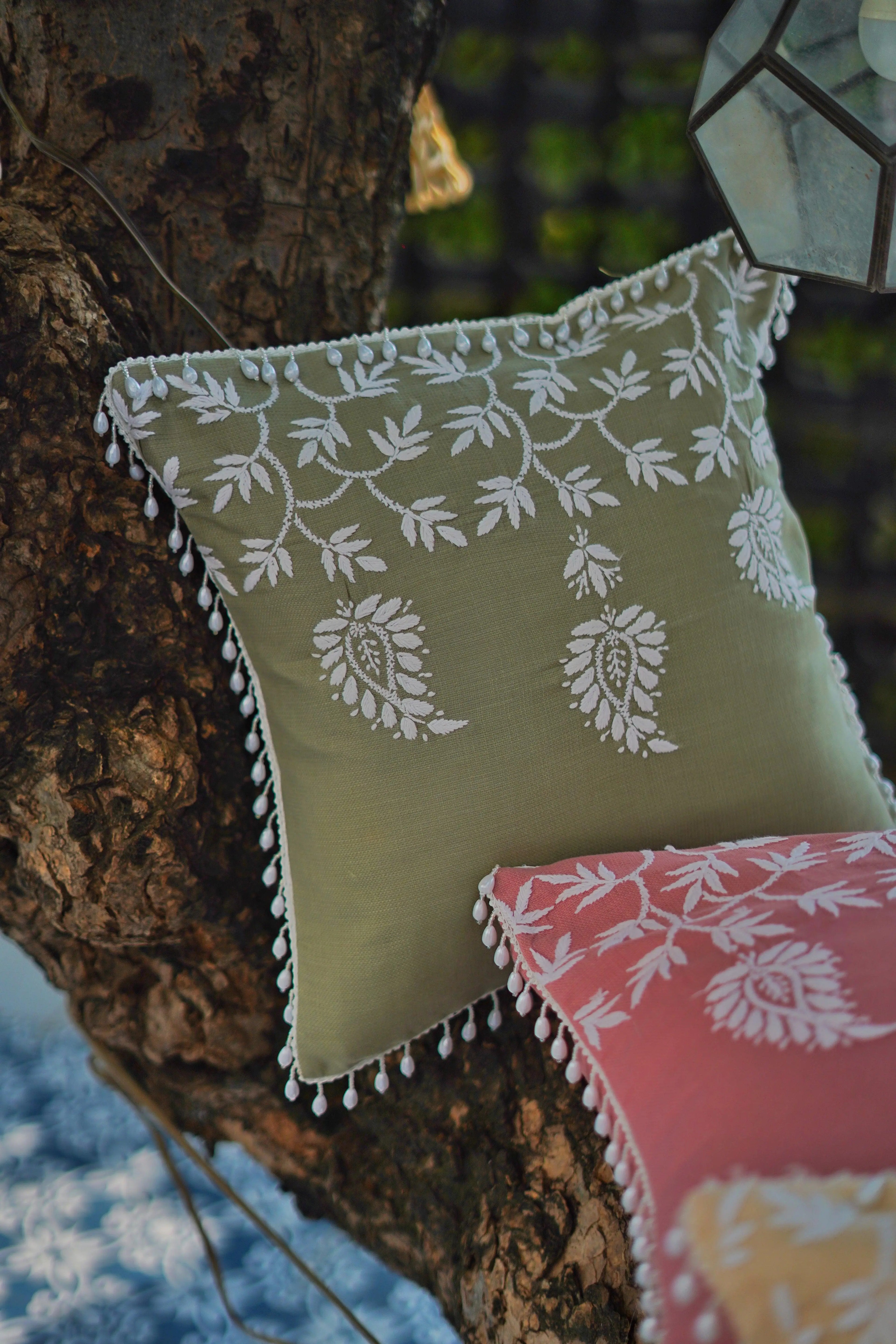 Beautiful hand-embroidered cushion cover from Sukhara, highlighting elegant mango field patterns, ideal for sophisticated home furnishings