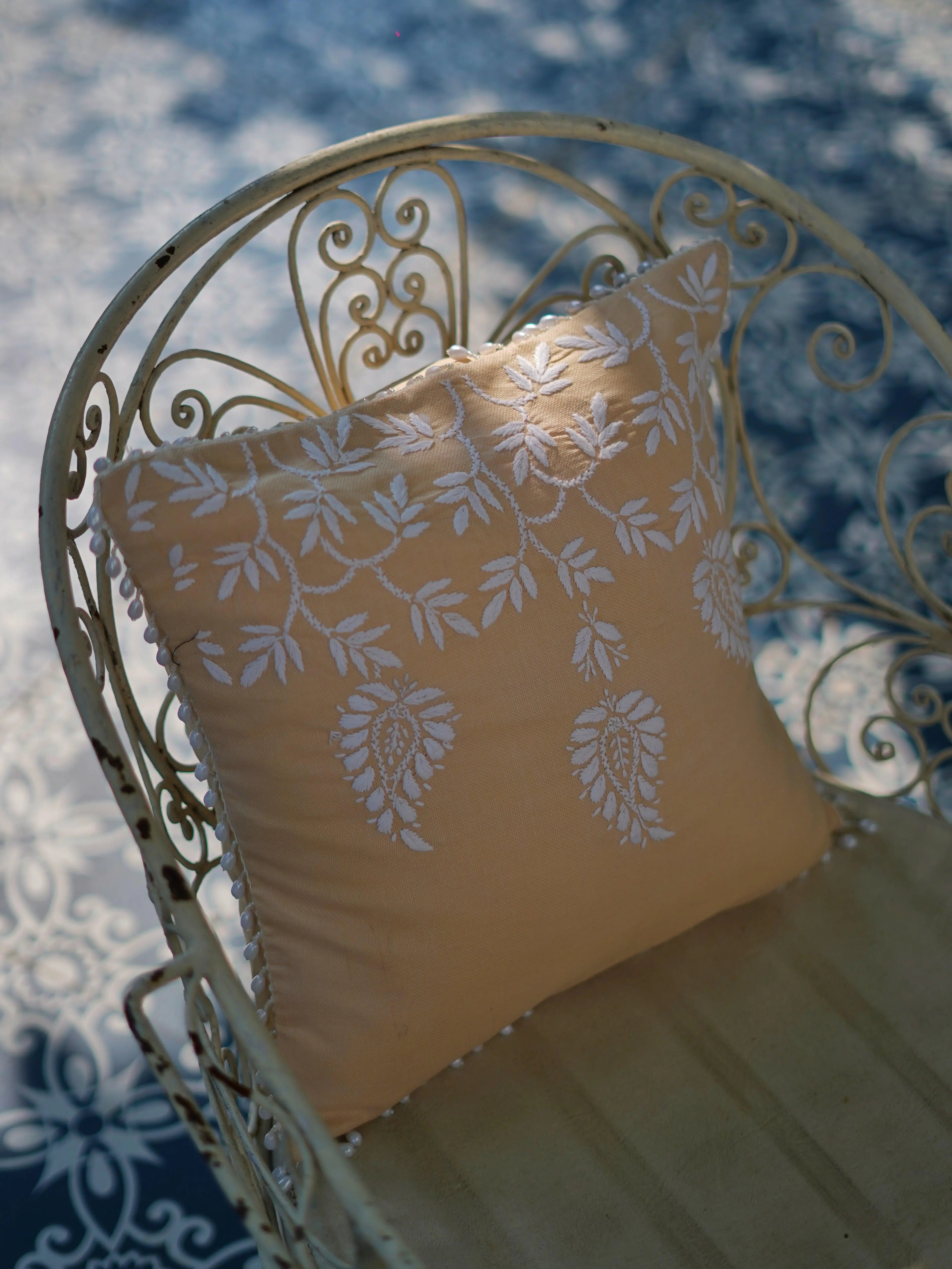 Unique home decor gifts from Sukhara, showcasing stunning Chikankari cushion covers with mango tree motifs, ideal for any occasion