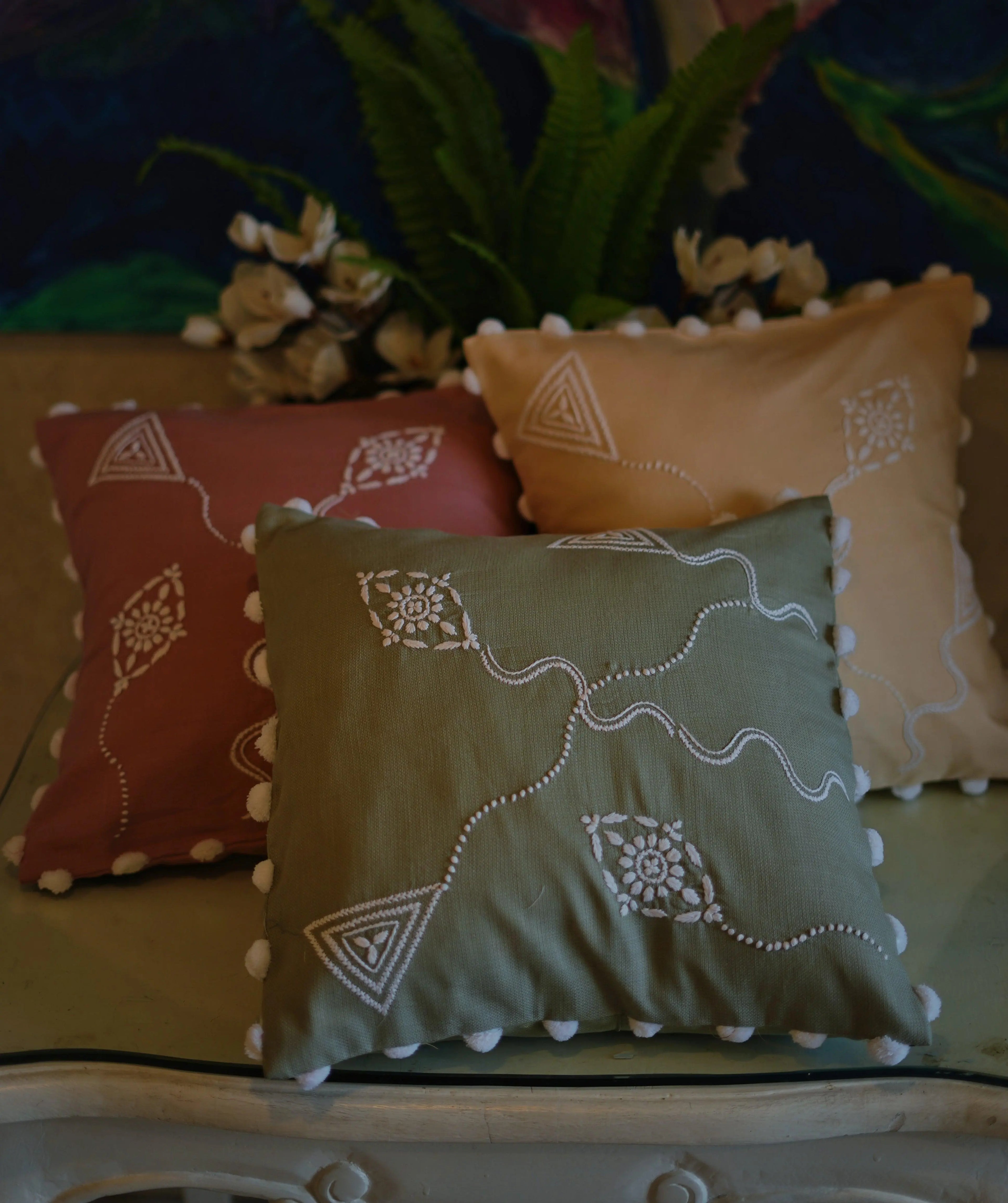 Diverse collection of colorful Chikankari cushion covers by Sukhara, embodying the vibrant aesthetic of Lucknow&