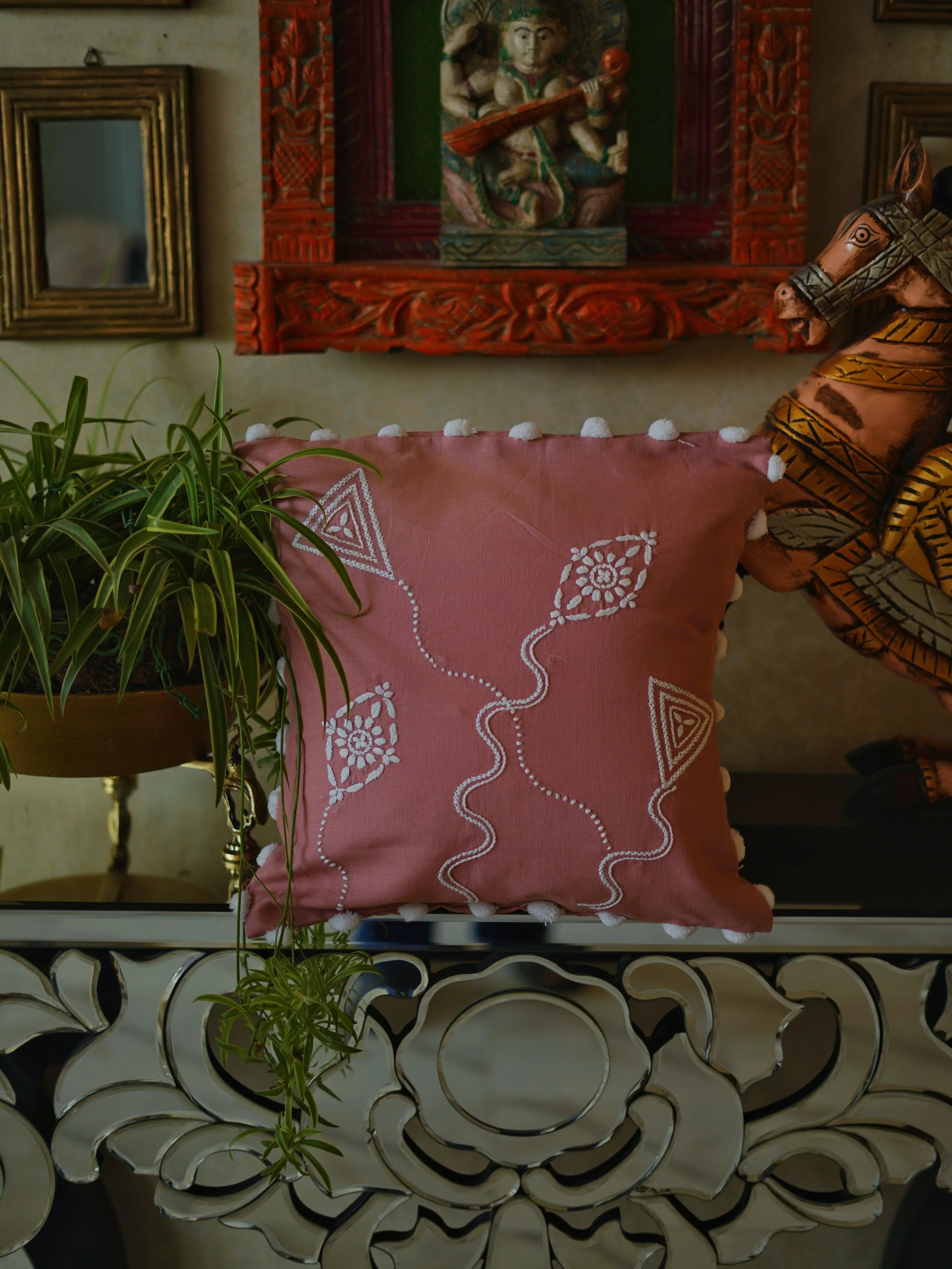 Intricate hand-embroidered Chikankari cushion cover by Sukhara featuring traditional floral designs inspired by Lucknow&